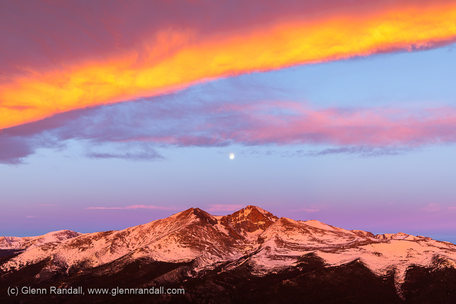 The full moon setting over Longs Peak from the summit of Twin Sisters, Rocky Mountain National Park, Colorado