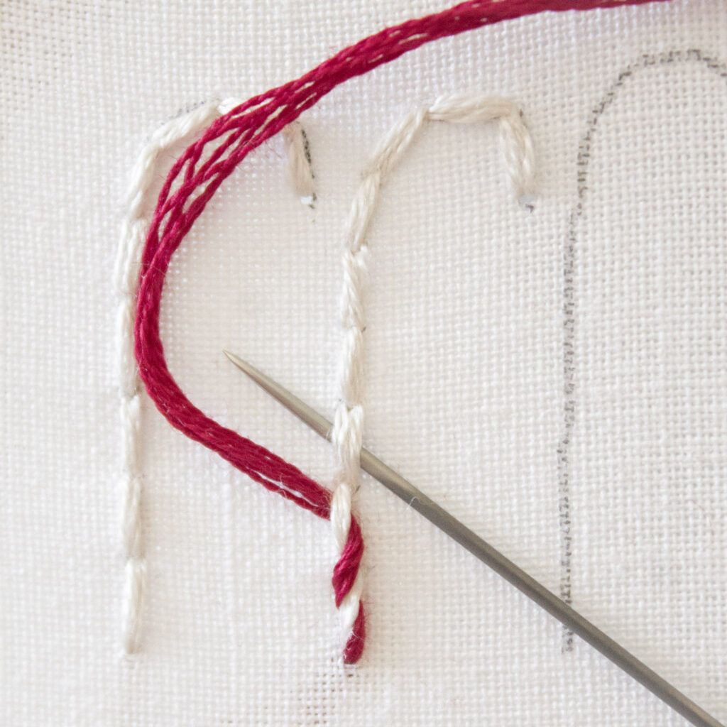 Step 5. Repeat needle underneath each stitch. The design is starting to look like a candy cane.