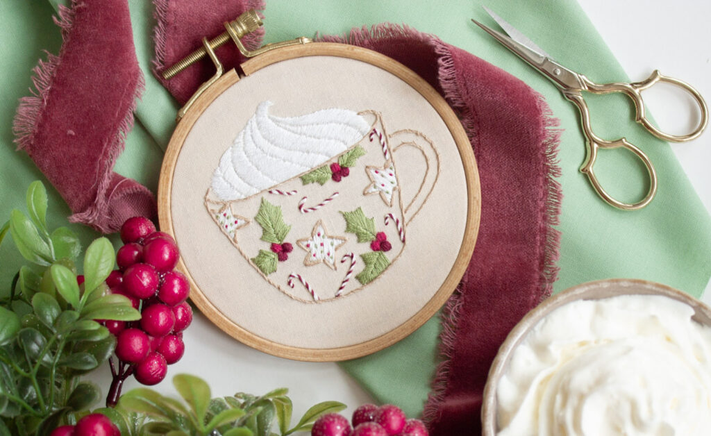 Christmas cup embroidered with various stitch techniques